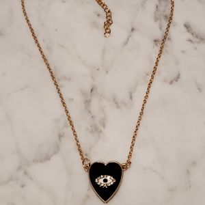 necklace with black heart and good luck eye